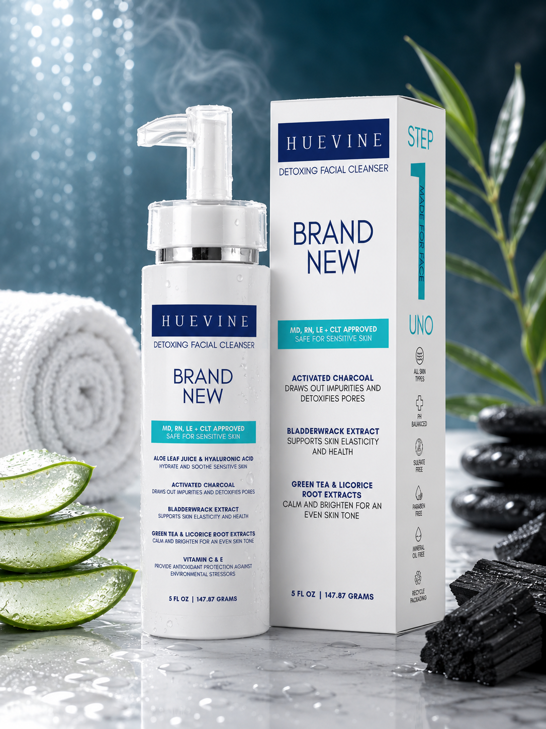 HueVine Brand New Detoxing Facial Cleanser with packaging displayed in a luxury spa setting with aloe vera, charcoal, towels, and decorative stones.