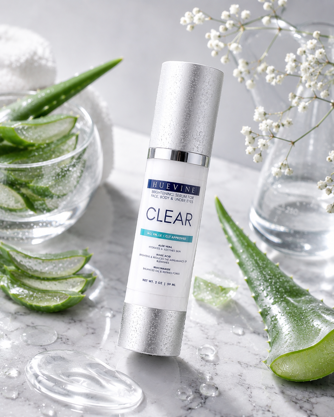HueVine Clear Brightening Serum surrounded by aloe vera and botanical ingredients in a luxury skincare display.
