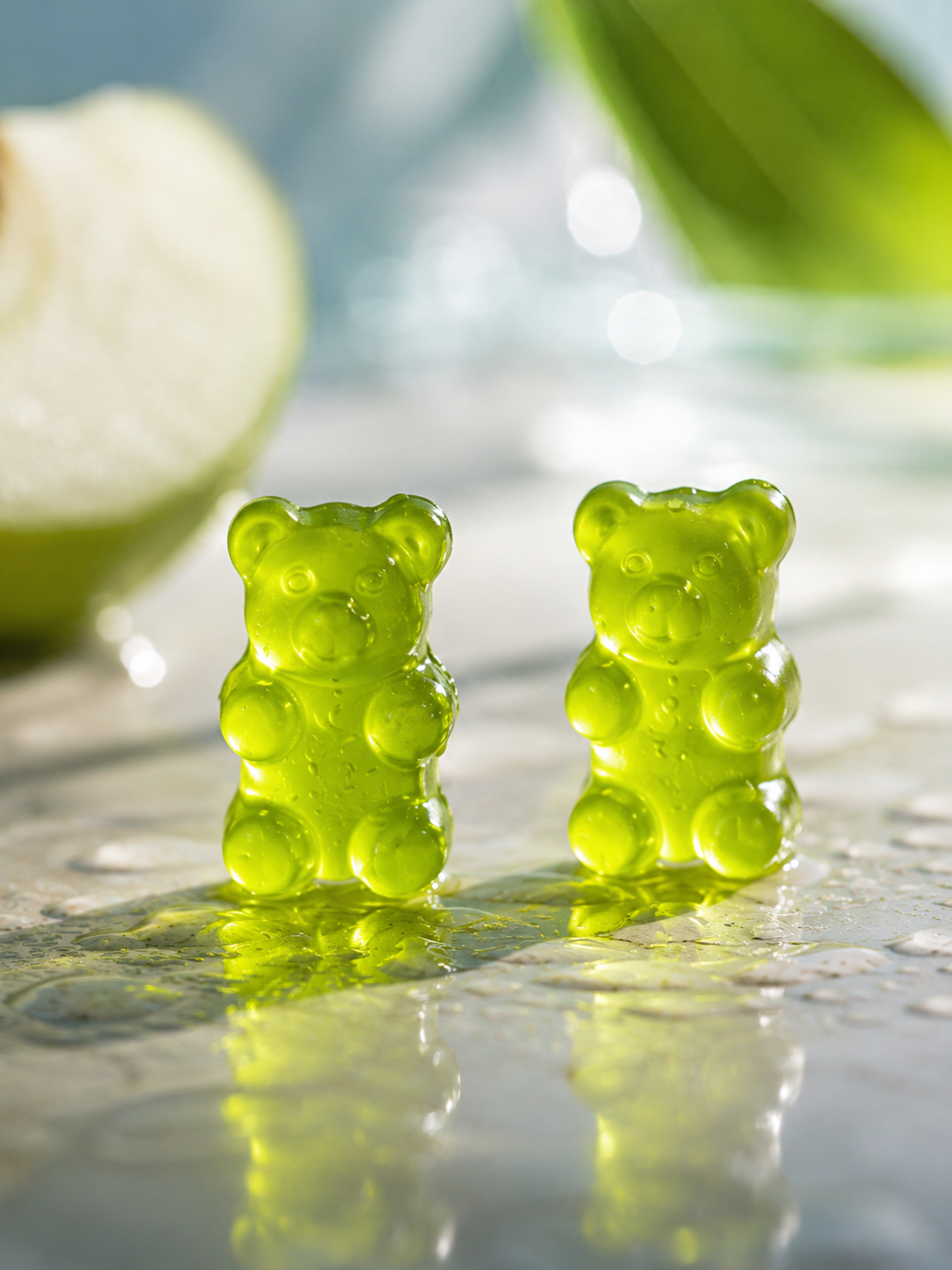 Close-up of HueVine Glory Glow green apple flavored vitamin gummies.