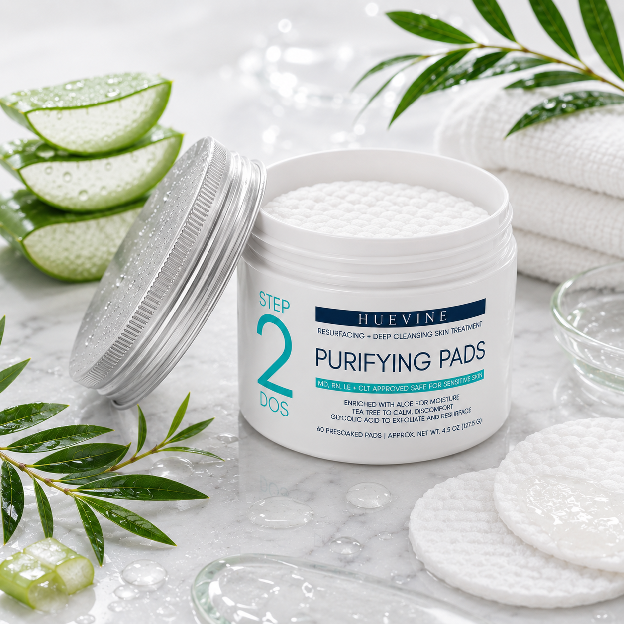 Open container of HueVine Purifying Pads displayed in a luxury spa-inspired skincare environment with aloe vera, botanical elements, and hydration styling.
